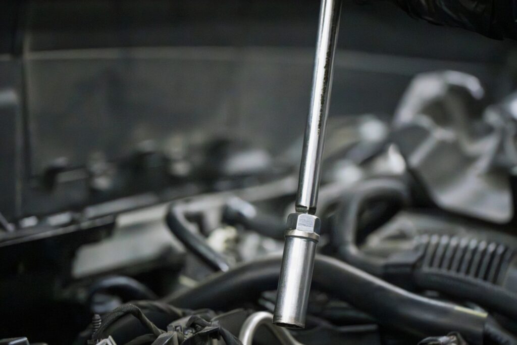 Mechanic Using Socket Wrench for Engine Repair
